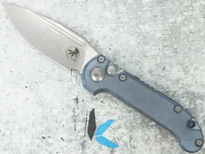 Microtech 1135-10MS11 LUDT Clip Point Marfione Select SW Ice Blue Anodized Slab Side Titanium w/ Blue Titanium Accent, Double Vapor Blast Stainless